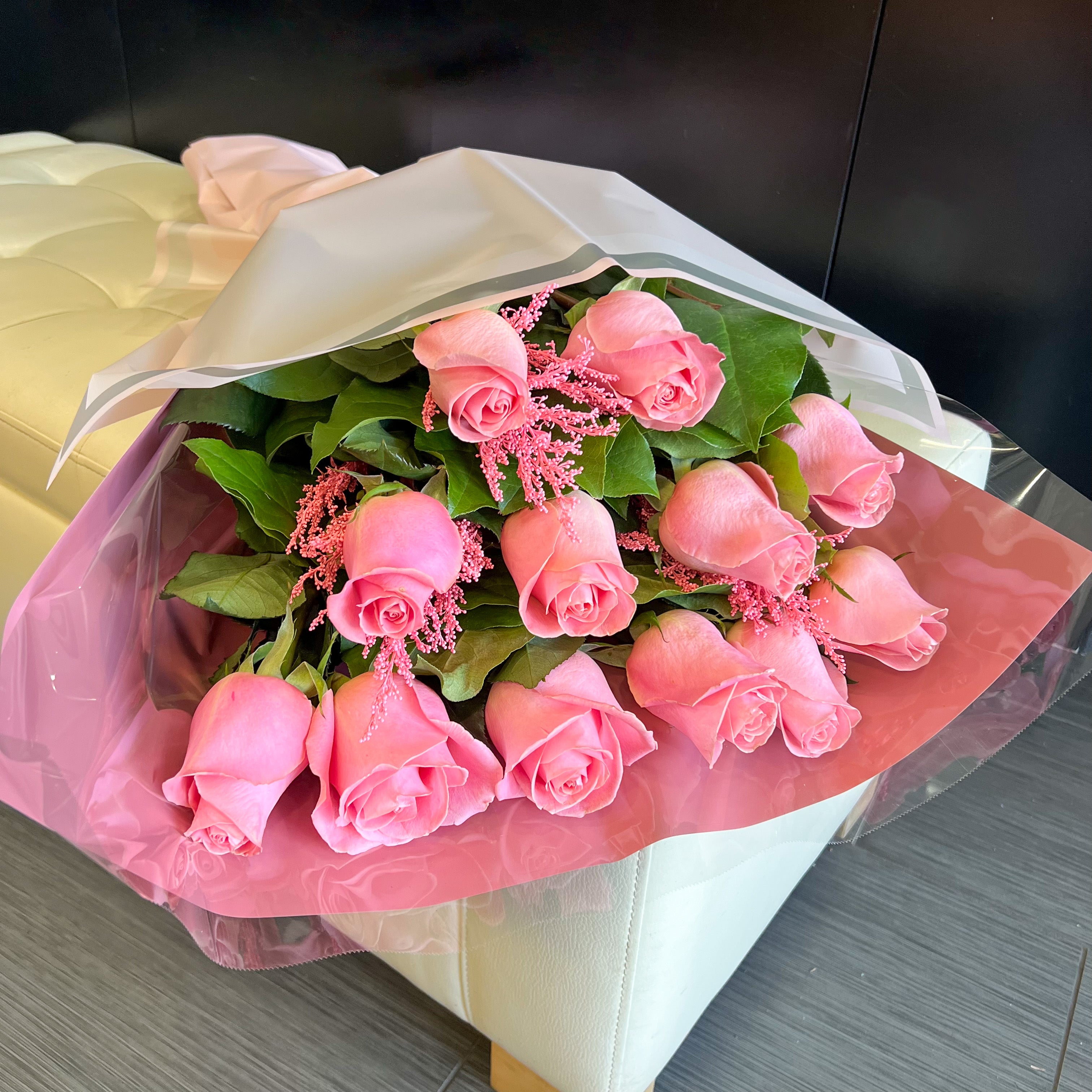 A Wrapped Bouquet of Pink Roses