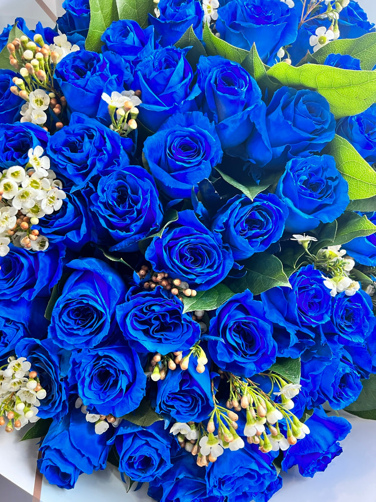 A wrapped Bouquet of Blue Roses