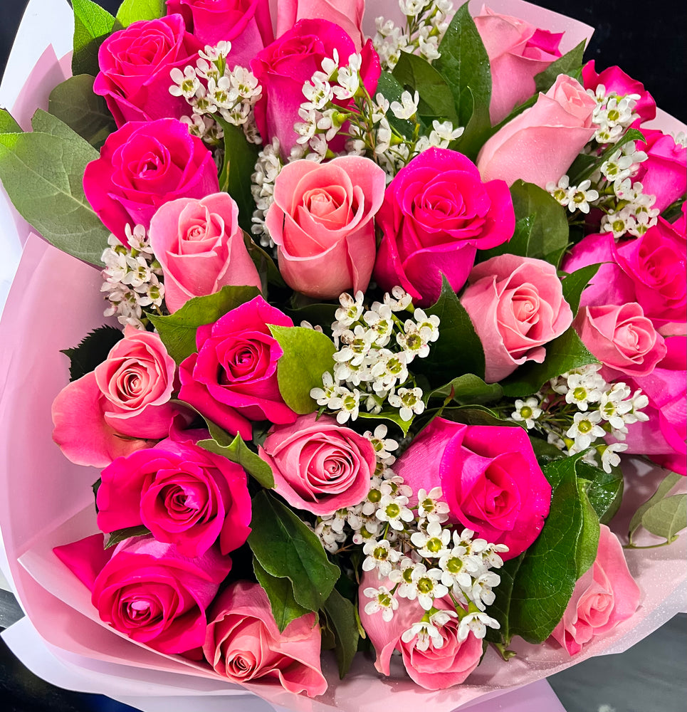 A Wrapped Bouquet of Pink and Hot Pink Roses