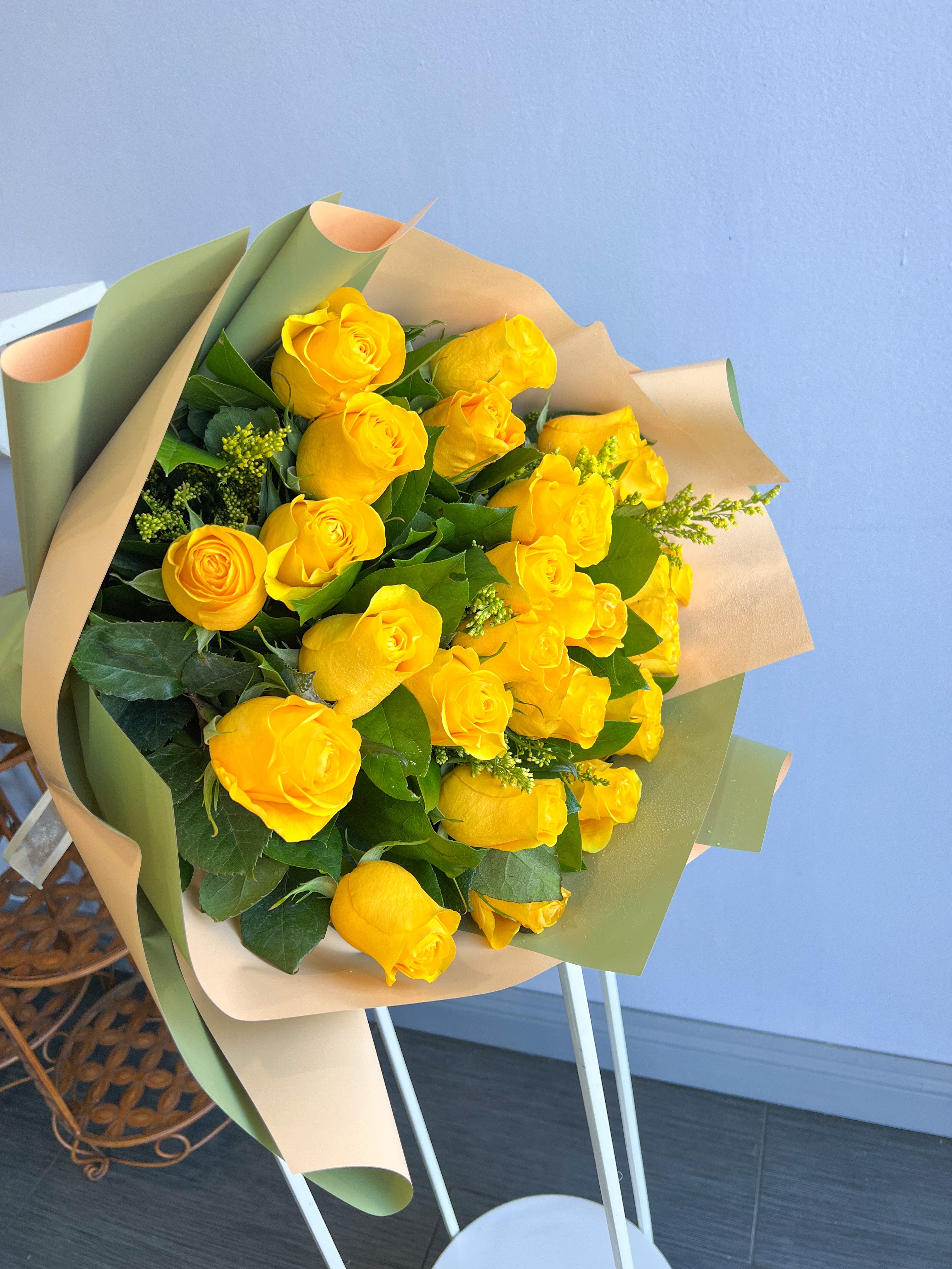 A Wrapped Bouquet of Yellow Roses