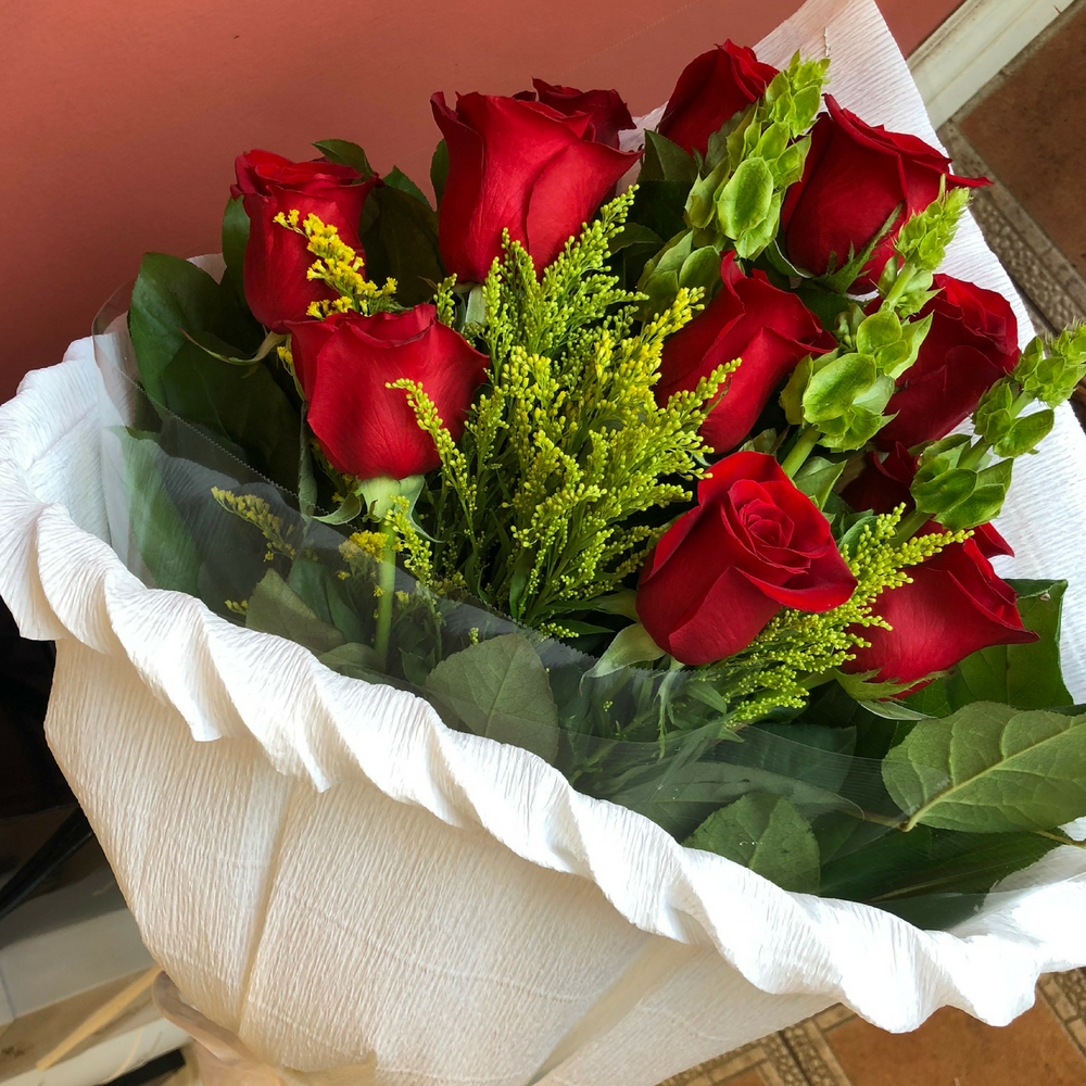 A Wrapped Bouquet of Red Roses